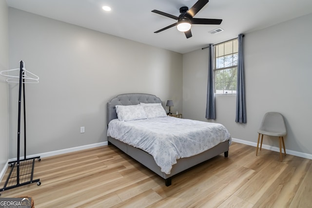 bedroom featuring ceiling fan and light hardwood / wood-style flooring