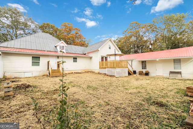 back of house with a yard