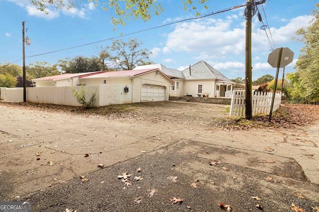 view of side of home featuring a garage