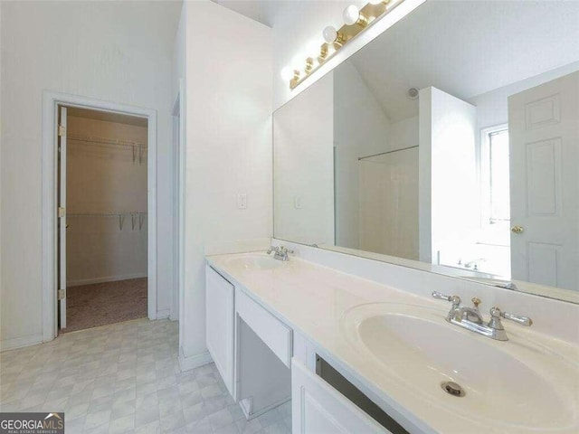 334 Royal Crescent Way, Stockbridge, GA 30281 - full bath featuring tile patterned floors, double vanity, a walk in closet, baseboards, and a shower