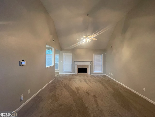 unfurnished living room featuring carpet flooring, ceiling fan, and high vaulted ceiling