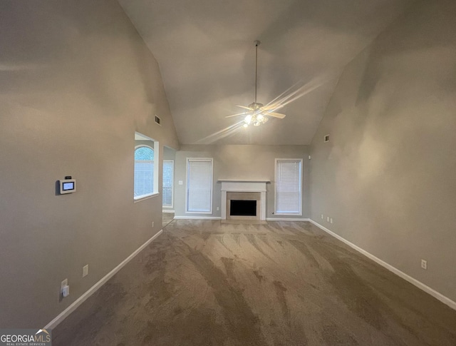334 Royal Crescent Way, Stockbridge, GA 30281 - unfurnished living room featuring baseboards, ceiling fan, carpet, high vaulted ceiling, and a fireplace