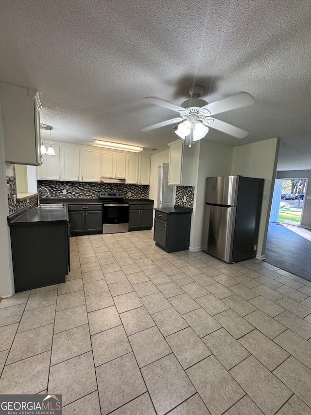 kitchen with ceiling fan, white cabinetry, a textured ceiling, and appliances with stainless steel finishes