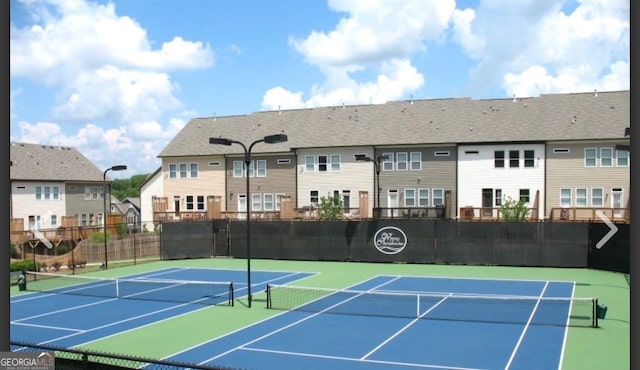 view of tennis court with basketball court