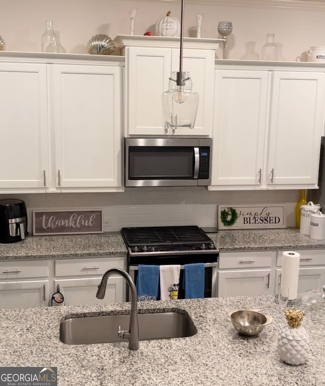 kitchen with white cabinets and stainless steel appliances