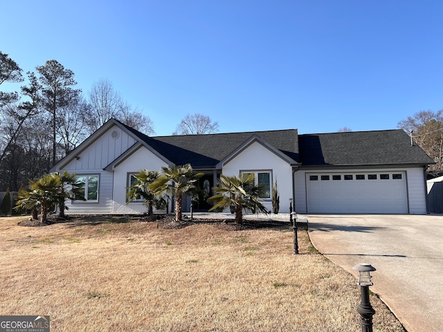 ranch-style house featuring a garage and a front yard