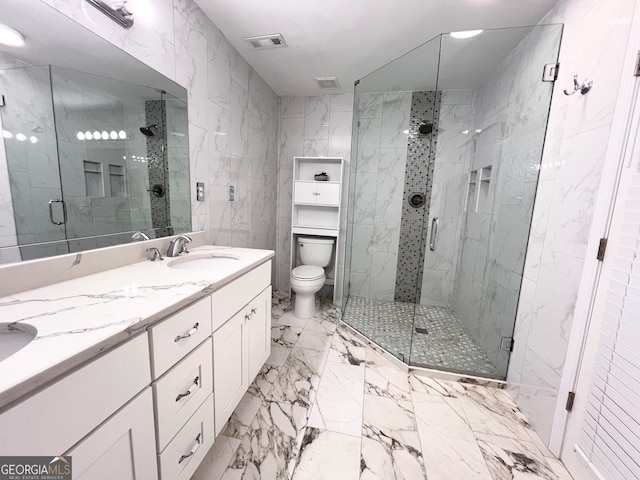 bathroom featuring vanity, toilet, an enclosed shower, and tile walls