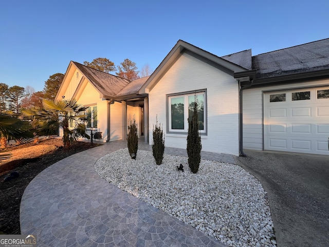 single story home with a garage