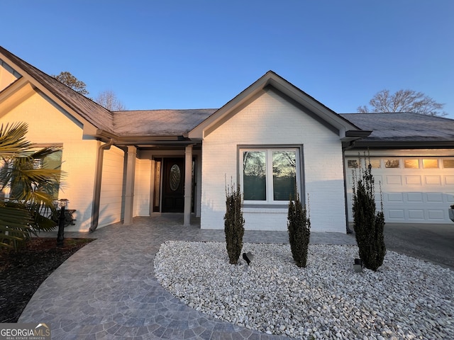 ranch-style home with a garage