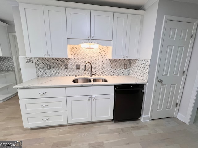 kitchen with dishwasher, white cabinets, light hardwood / wood-style floors, and sink