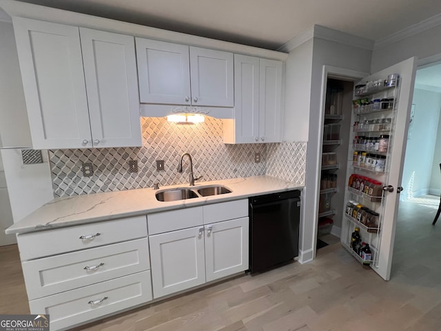 kitchen with white cabinets, black dishwasher, light hardwood / wood-style flooring, and sink