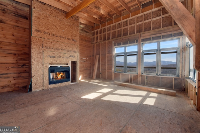 unfurnished living room with a mountain view and a fireplace