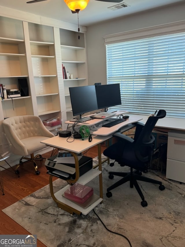 office with ceiling fan and wood-type flooring