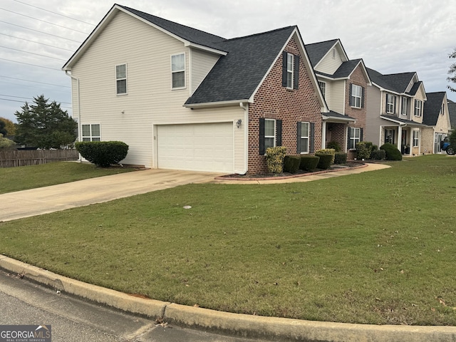 traditional-style home featuring a garage, driveway, brick siding, and a front yard