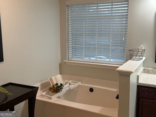 bathroom with vanity and a bathing tub