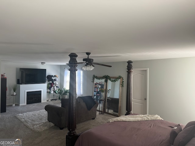 bedroom featuring light carpet and ceiling fan