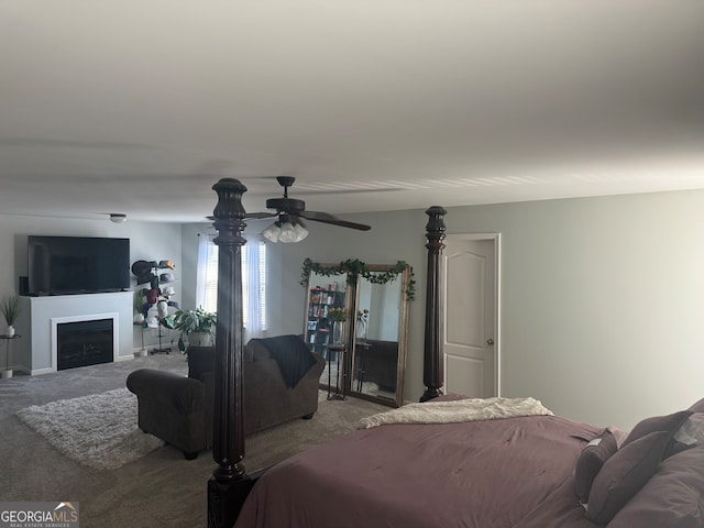 bedroom featuring ceiling fan and light carpet