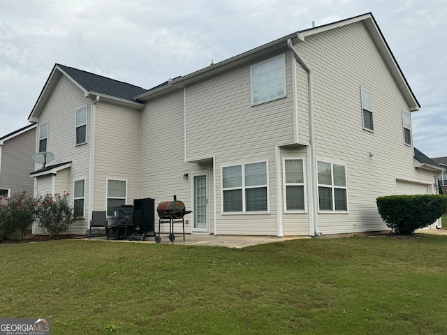 back of property featuring a lawn and a patio area