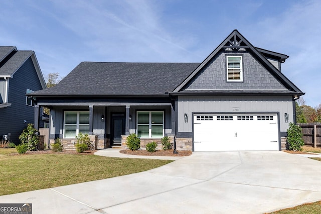 craftsman-style house with a porch and a front lawn