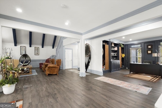 living room featuring dark hardwood / wood-style flooring and vaulted ceiling with beams