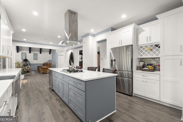 kitchen with island exhaust hood, stainless steel appliances, gray cabinets, white cabinetry, and a kitchen island