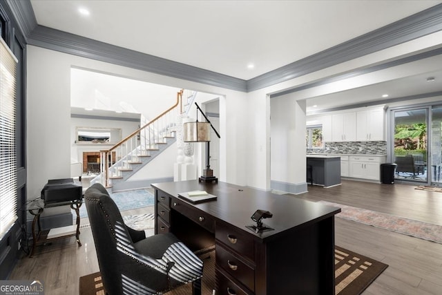 office featuring dark wood-type flooring and crown molding