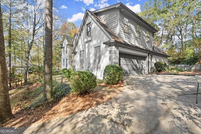 view of side of property with a garage