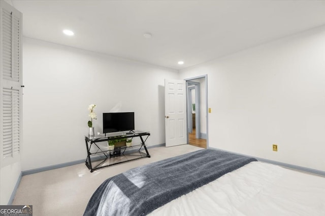 bedroom featuring light carpet