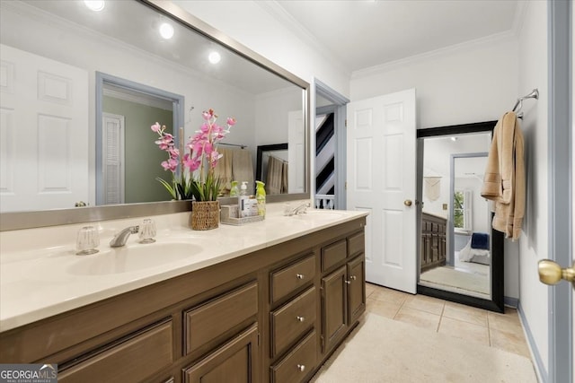 bathroom with ornamental molding, tile patterned floors, and vanity