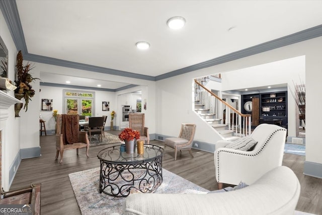 living room featuring dark hardwood / wood-style flooring and ornamental molding