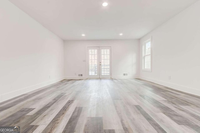 5483 Wylstream, Norcross, GA 30093 - empty room with recessed lighting, light wood-style flooring, baseboards, and french doors