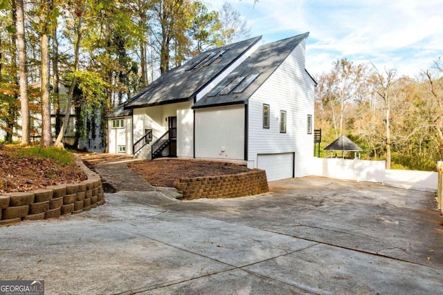 view of property exterior featuring a garage