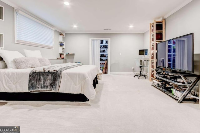 carpeted bedroom with ornamental molding