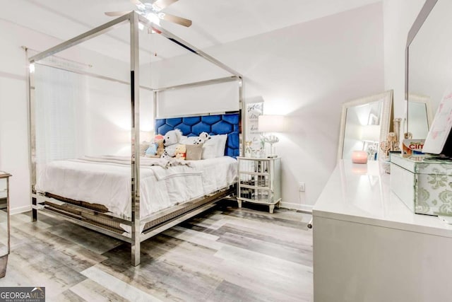 bedroom featuring ceiling fan and wood-type flooring