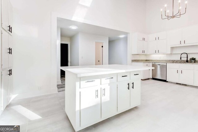 5483 Wylstream, Norcross, GA 30093 - kitchen with dishwasher, light countertops, a high ceiling, white cabinets, and a sink