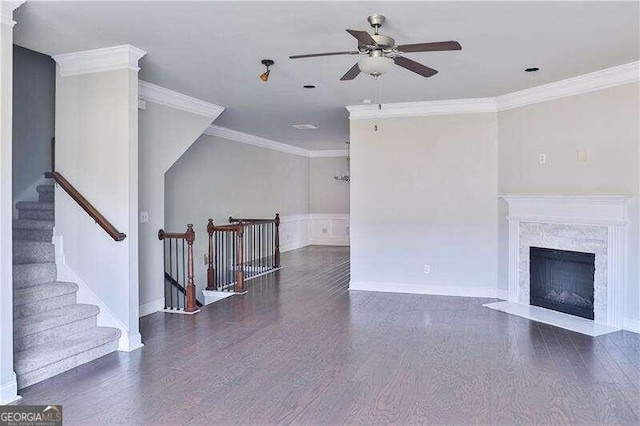 living room featuring a fireplace, dark wood-type flooring, and ornamental molding