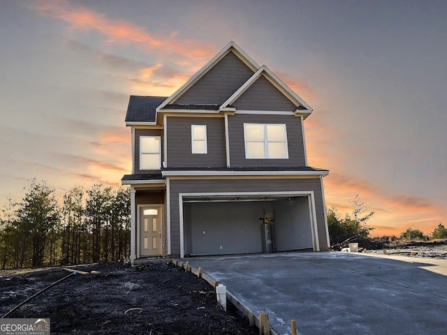 view of front of house featuring a garage and concrete driveway