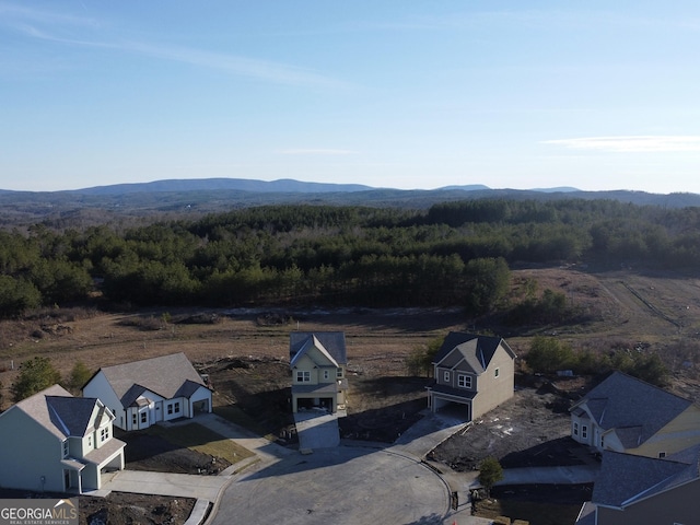 birds eye view of property with a residential view and a mountain view