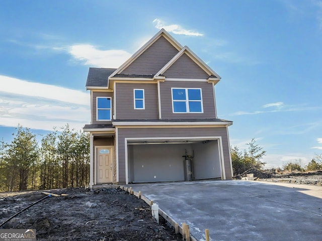 view of front of property featuring driveway and an attached garage