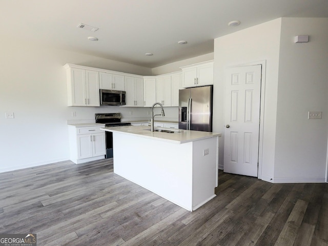 kitchen featuring a sink, white cabinetry, stainless steel appliances, and light countertops