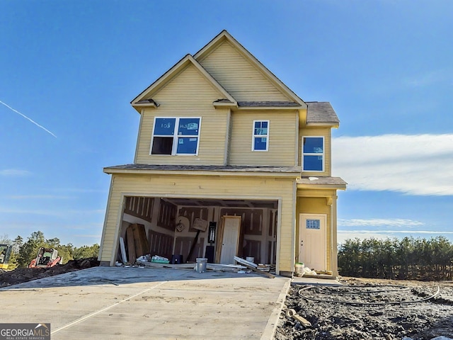 view of front facade with driveway and an attached garage