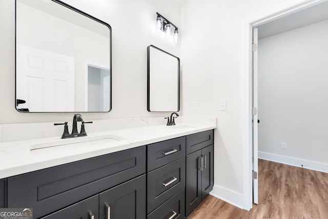 bathroom featuring vanity and hardwood / wood-style flooring