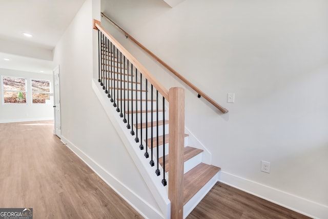 stairway featuring hardwood / wood-style flooring