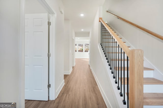 hallway with light wood-type flooring