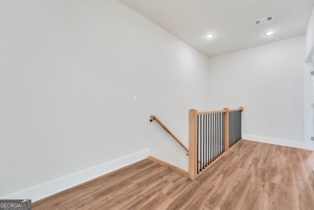 staircase featuring hardwood / wood-style flooring