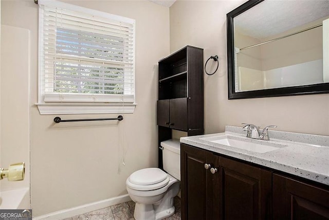 full bathroom featuring bathtub / shower combination, vanity, and toilet