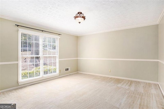 unfurnished room featuring a textured ceiling, carpet floors, and crown molding