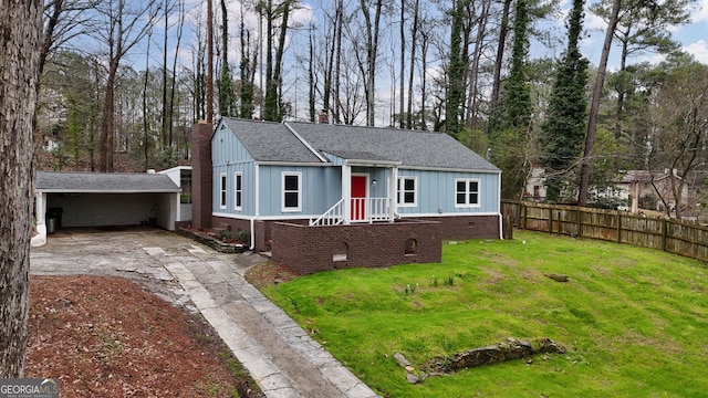 view of front of house featuring a front lawn, fence, board and batten siding, concrete driveway, and crawl space