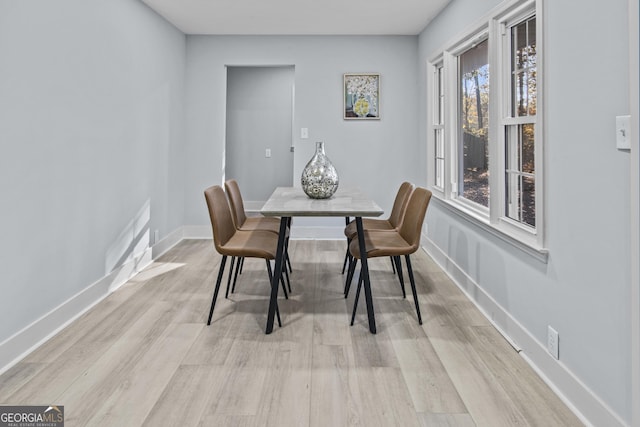 dining area featuring light wood-type flooring