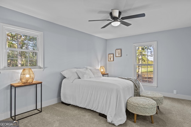 carpeted bedroom featuring ceiling fan